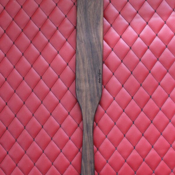 Long Walnut BDSM Gear paddle for impact play. Stingy for bench work