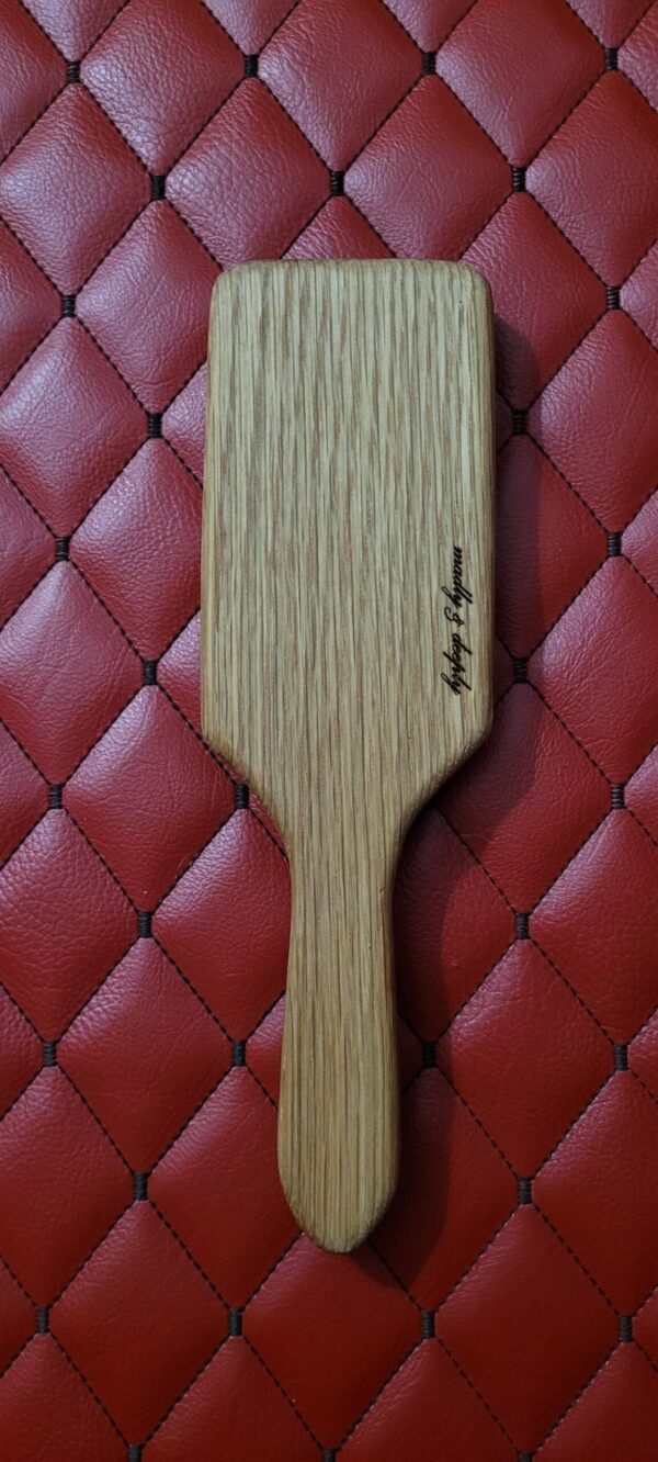Small Oak BDSM paddle for spanking and impact play. Hairbrush styled design. Great for OTK or role play.